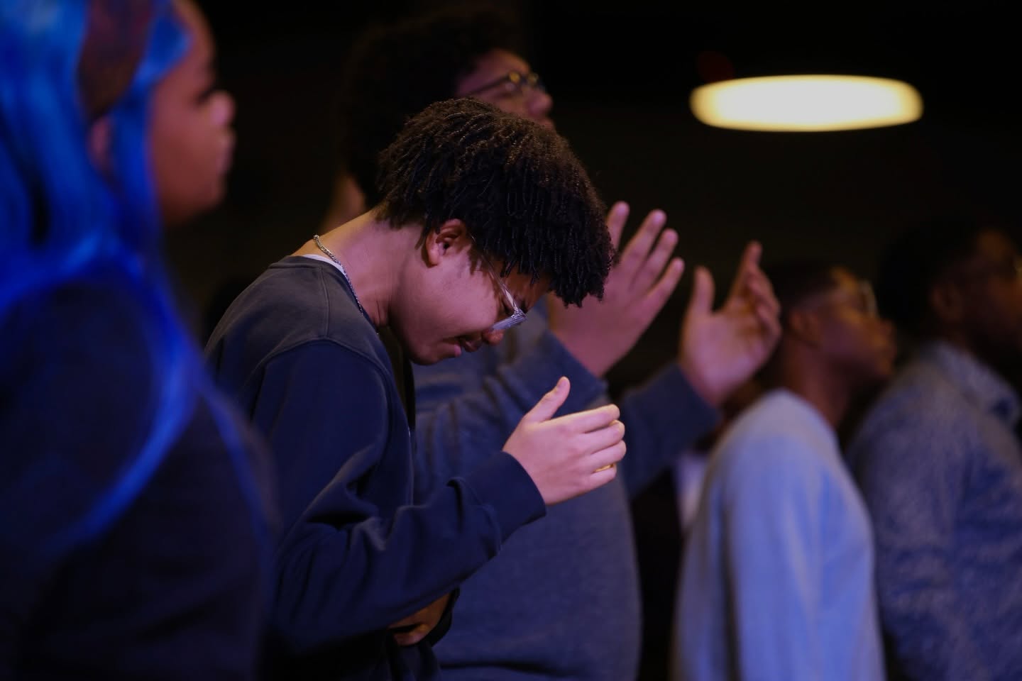 Young people in prayer at Embassy Covenant Church